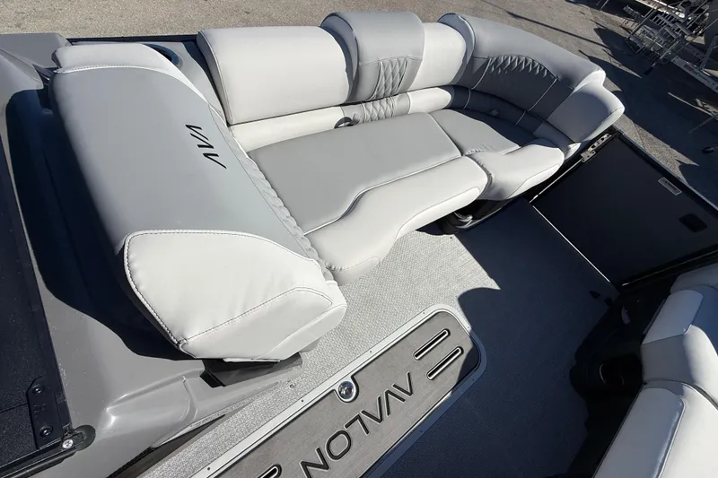 Slide: The Image of 2026 Avalon 2385 Catalina Windshield Quade Lounger interior with gray seating and flooring. - 18