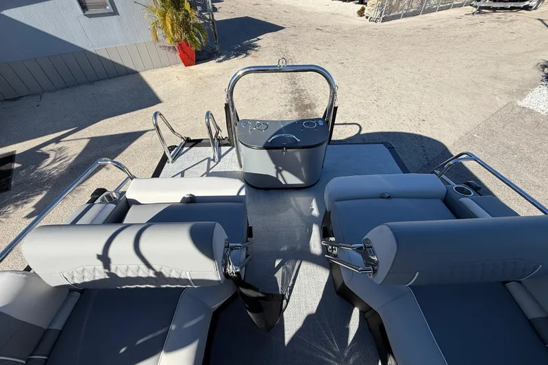 Slide: The Image of 2026 Avalon 2385 Catalina Windshield Quade Lounger, Tri Toon boat interior with plush seating. - 30