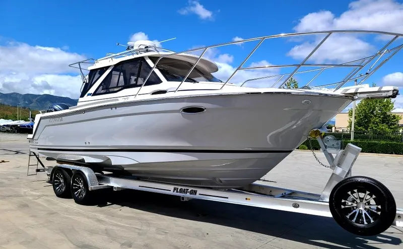 The Image of 2023 Cutwater C-248 Coupe on trailer, side view. - 1