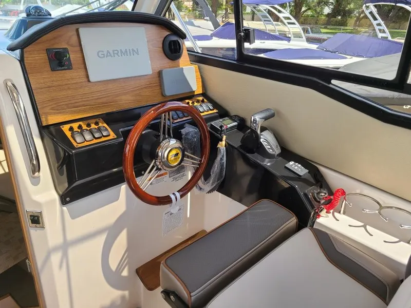 Slide: The Image of Interior view of 2023 Cutwater C-248 Coupe cockpit with Garmin controls. - 10