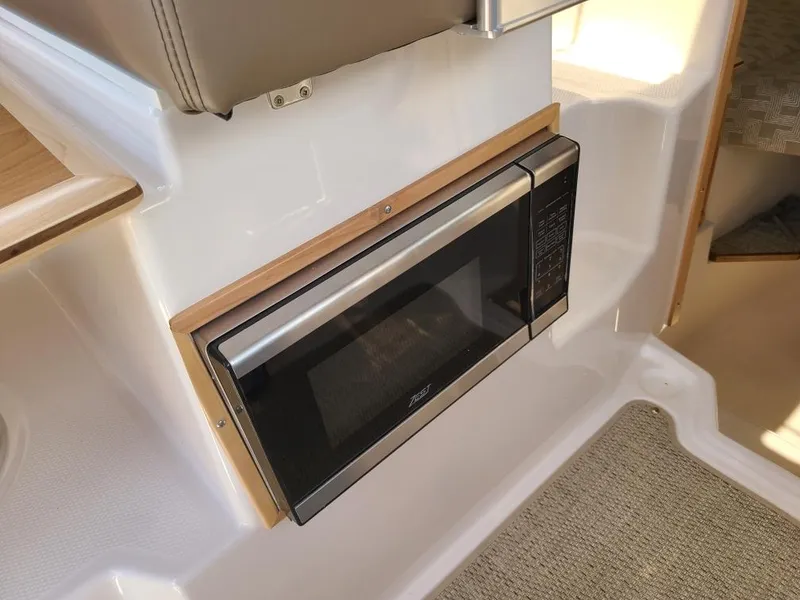 Slide: The Image of Microwave inside the 2023 Cutwater C-248 Coupe interior. - 11