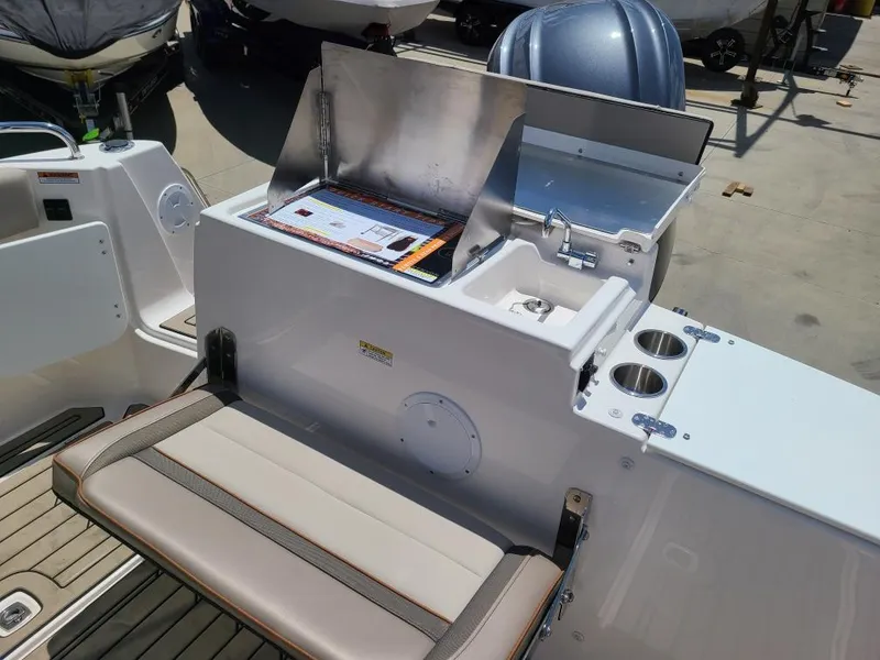 Slide: The Image of 2023 Cutwater C-248 Coupe boat with seating and grill. - 14