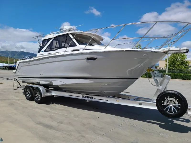 Slide: The Image of 2023 Cutwater C-248 Coupe on trailer, sunny day. - 3