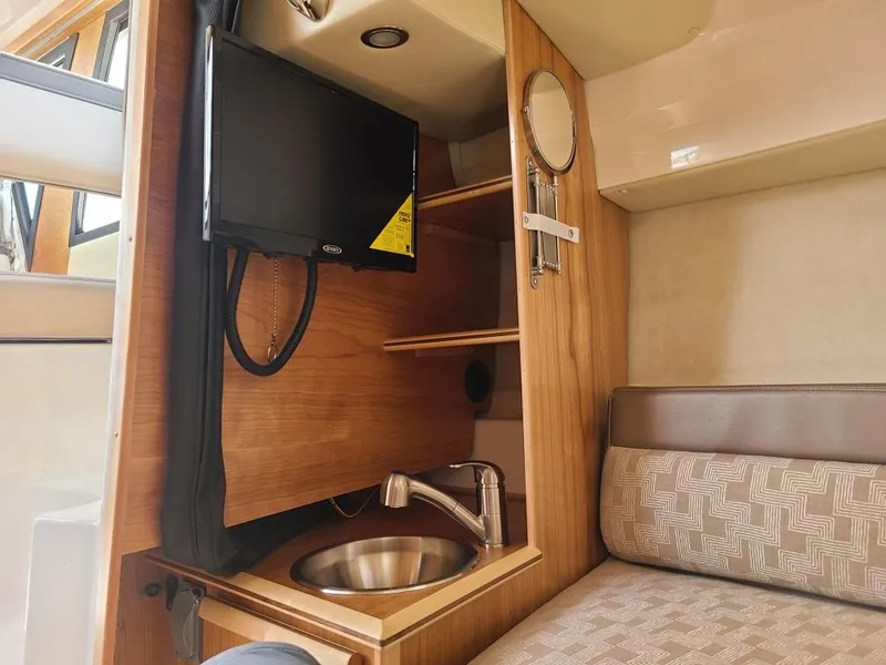 Slide: The Image of 2023 Cutwater C-248 Coupe interior with TV and sink. - 6