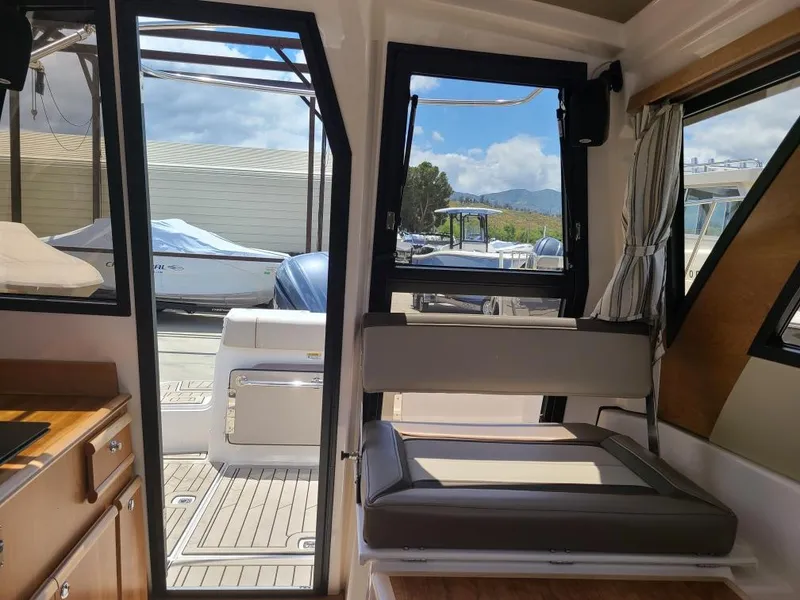 Slide: The Image of Interior of 2023 Cutwater C-248 Coupe with harbor view. - 8