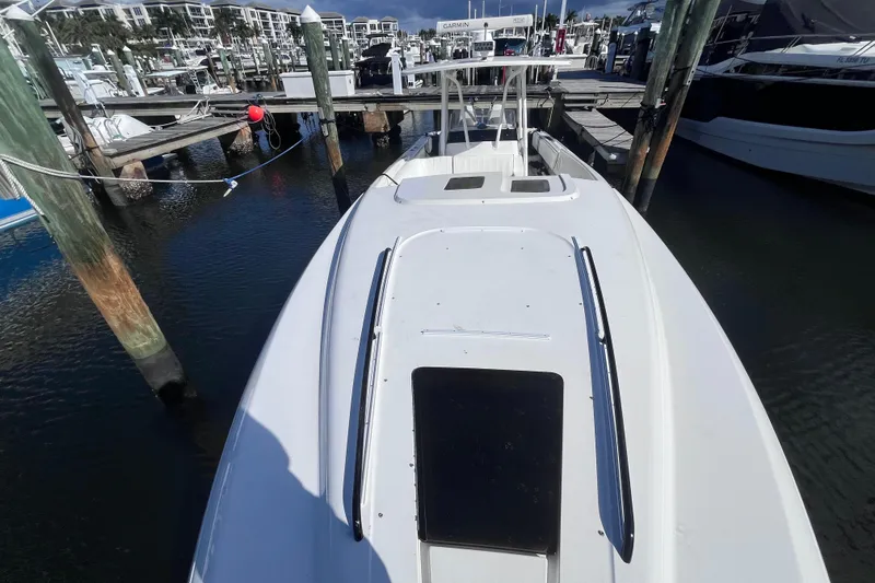 Slide: The Image of 2008 Intrepid 370 Cuddy boat with white seating and dual outboard motors. - 17
