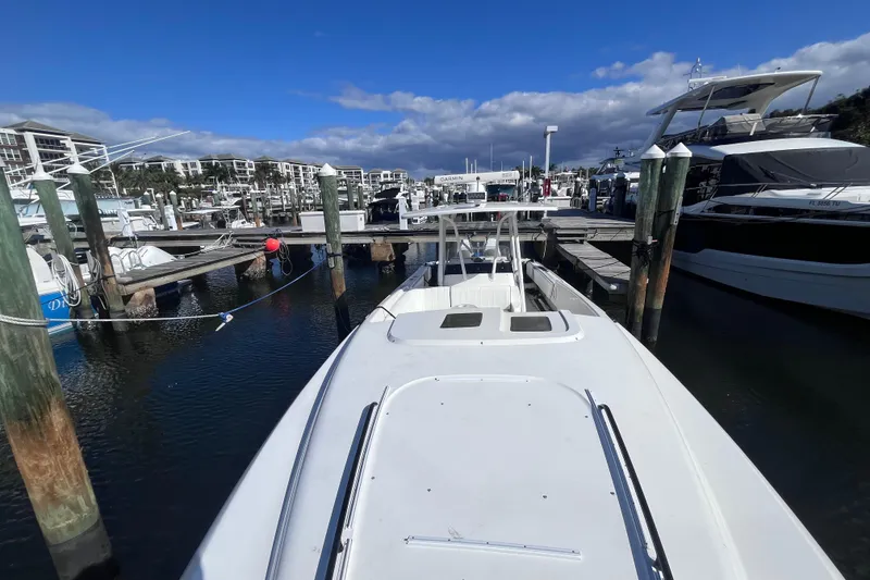 Slide: The Image of 2008 Intrepid 370 Cuddy boat docked at marina, viewed from bow. - 18