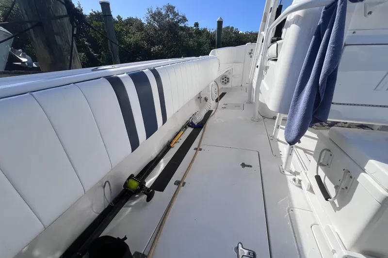 Slide: The Image of 2008 Intrepid 370 Cuddy boat interior with storage and seating area. - 29