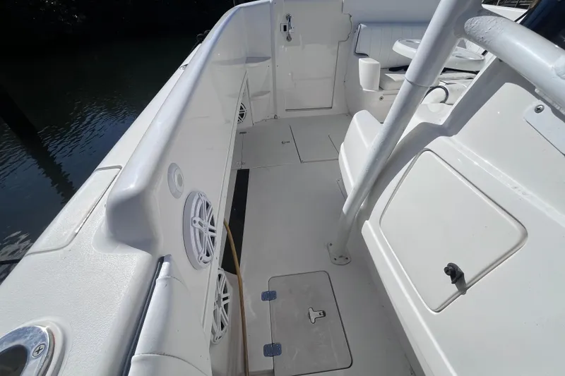 Slide: The Image of 2008 Intrepid 370 Cuddy boat interior with steering wheel and dock view. - 31