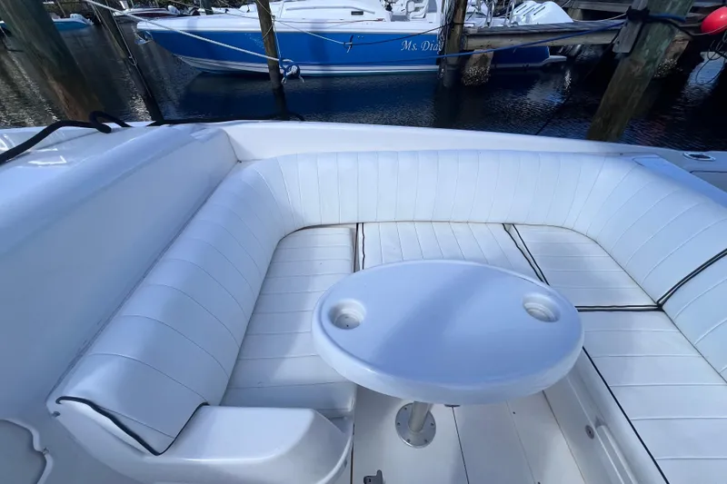 Slide: The Image of 2008 Intrepid 370 Cuddy boat docked in a serene waterfront setting. - 36