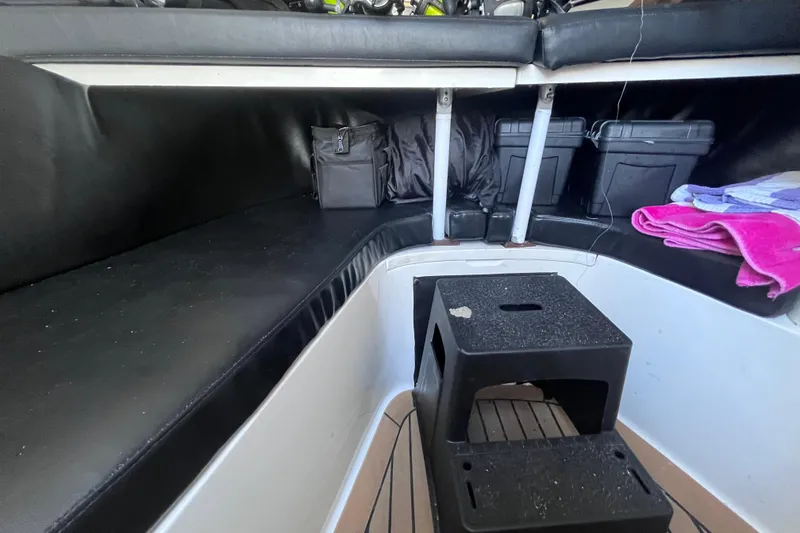 Slide: The Image of 2008 Intrepid 370 Cuddy cabin interior with fishing rods and gear. - 40