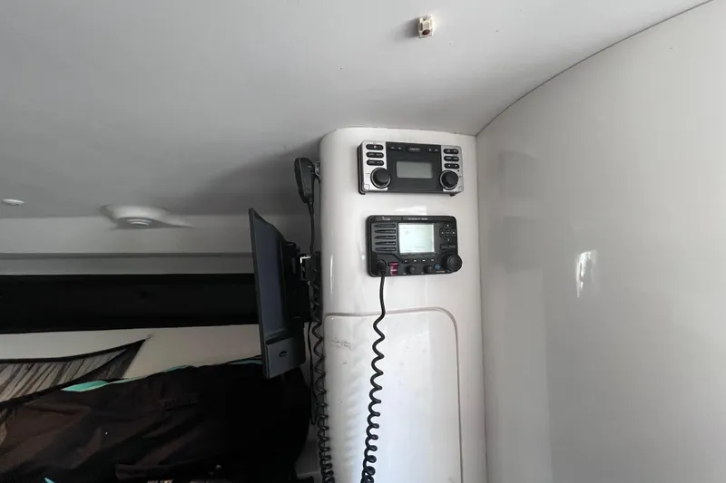 Slide: The Image of Interior of 2008 Intrepid 370 Cuddy with mounted electronics and storage area. - 42