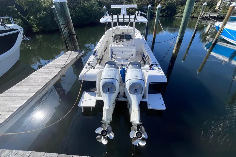 Slide: The Image of 2008 Intrepid 370 Cuddy boat docked with dual outboard engines. - 5