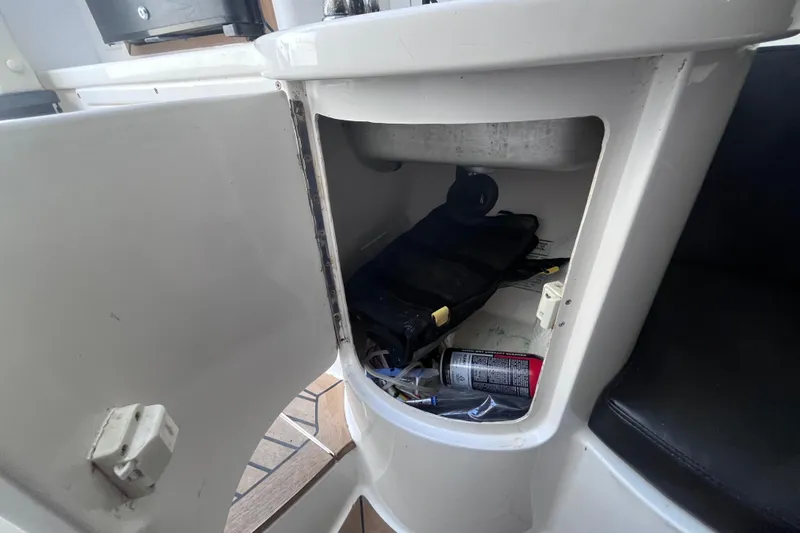 Slide: The Image of 2008 Intrepid 370 Cuddy boat bathroom with toilet and storage cabinets. - 50
