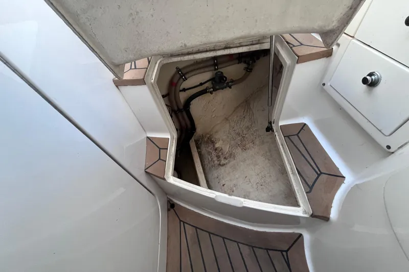 Slide: The Image of Staircase on 2008 Intrepid 370 Cuddy boat with wood finish and metal accents. - 52