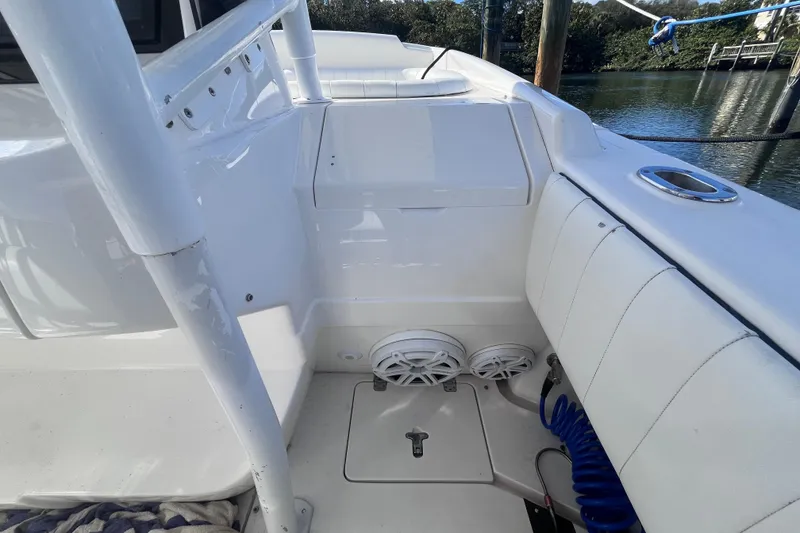 Slide: The Image of Open storage compartment on a 2008 Intrepid 370 Cuddy boat. - 66