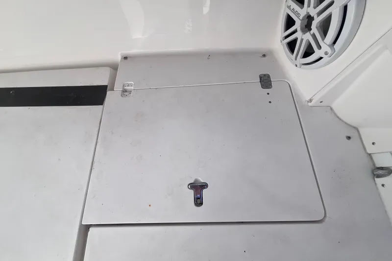 Slide: The Image of 2008 Intrepid 370 Cuddy boat interior with fishing gear and white seating. - 70