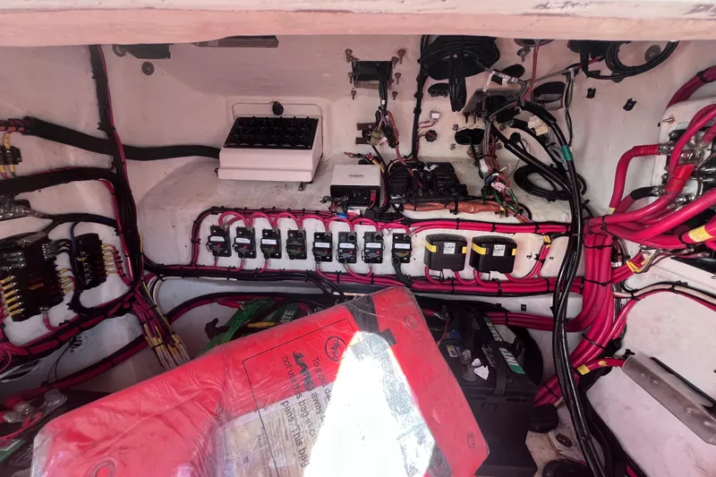 Slide: The Image of Electrical compartment of a 2008 Intrepid 370 Cuddy boat with wiring and equipment. - 84