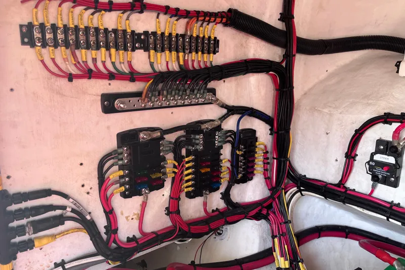 Slide: The Image of Electrical wiring and components inside a 2008 Intrepid 370 Cuddy boat. - 85