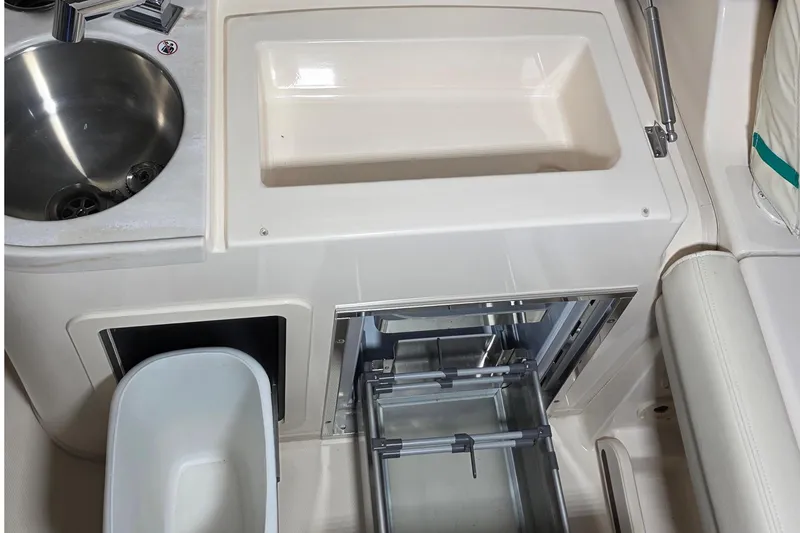 Slide: The Image of Interior of 2019 Grady-White Freedom 307 with sink and storage. - 14