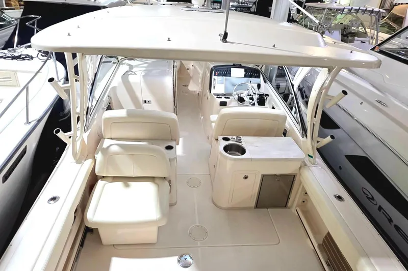 Slide: The Image of Interior view of a 2019 Grady-White Freedom 307 boat in a marina. - 20