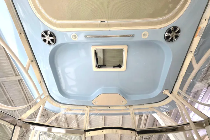 Slide: The Image of 2019 Grady-White Freedom 307 boat interior ceiling with speakers and hatch. - 22