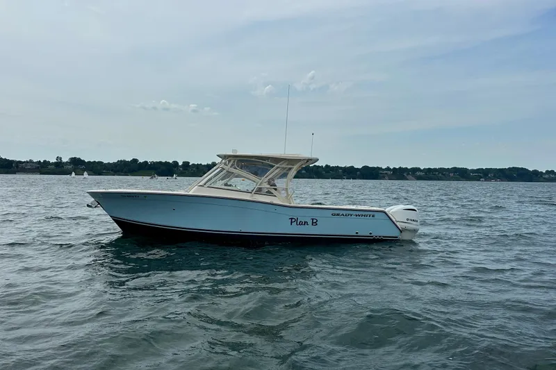 Slide: The Image of 2019 Grady-White Freedom 307 boat on open water, side view. - 7