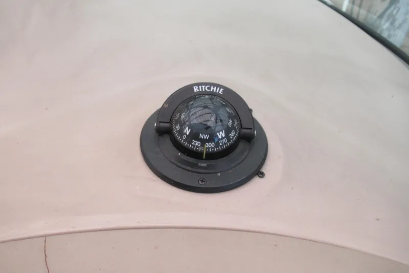 Slide: The Image of Ritchie compass on 2001 Searay 280 Sundancer boat dashboard. - 19