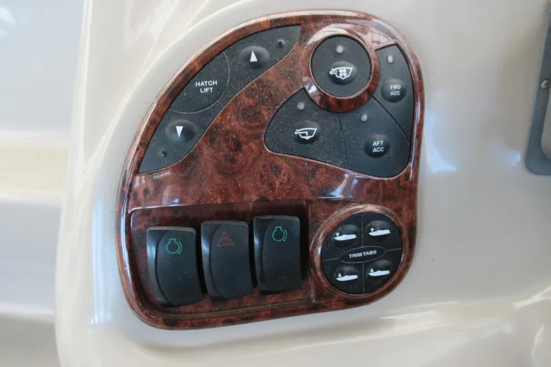 Slide: The Image of Control panel of a 2001 Searay 280 Sundancer boat with woodgrain finish. - 20