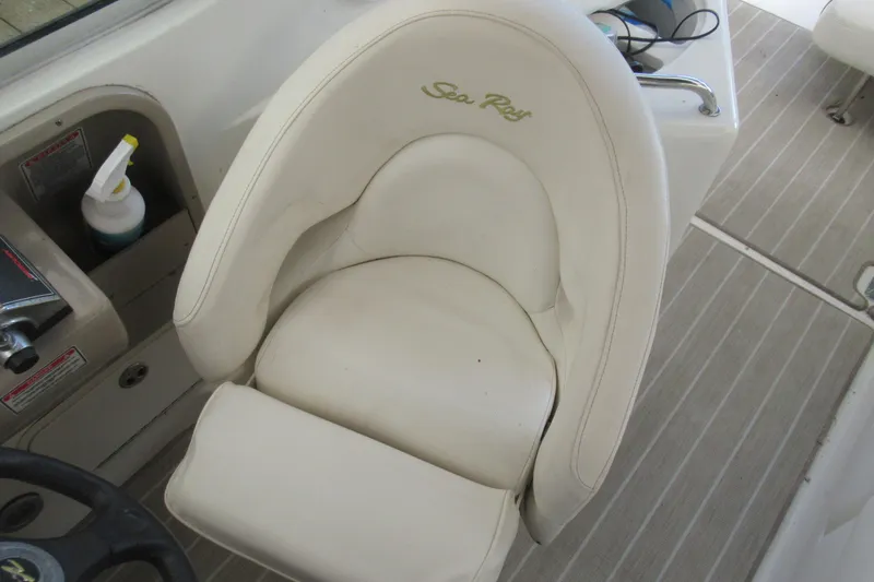 Slide: The Image of White captain's chair on 2001 Searay 280 Sundancer boat, featuring "Sea Ray" logo. - 27
