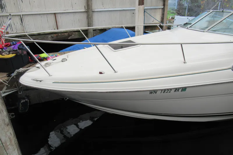 Slide: The Image of 2001 Searay 280 Sundancer docked in a marina, side view. - 3