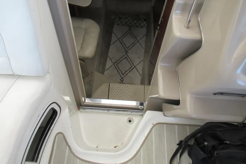 Slide: The Image of Interior view of 2001 Searay 280 Sundancer boat, showing cabin entrance and seating area. - 32