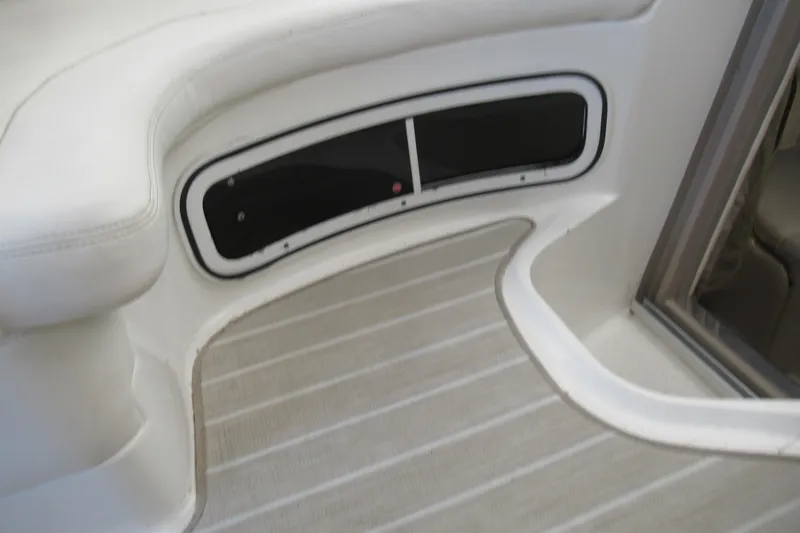 Slide: The Image of Interior view of 2001 Searay 280 Sundancer boat, featuring seating and storage area. - 35