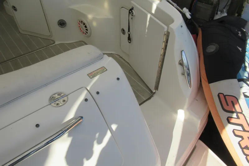 Slide: The Image of 2001 Searay 280 Sundancer boat interior with seating and storage compartments. - 47