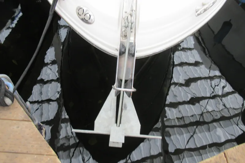 Slide: The Image of Bow view of 2001 Searay 280 Sundancer with anchor, docked on reflective water. - 5