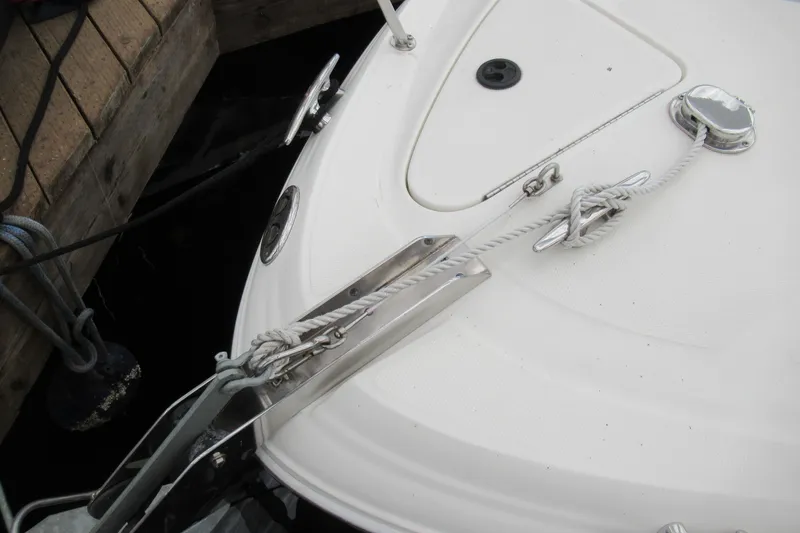 Slide: The Image of 2001 Searay 280 Sundancer boat docked with secured ropes. - 6