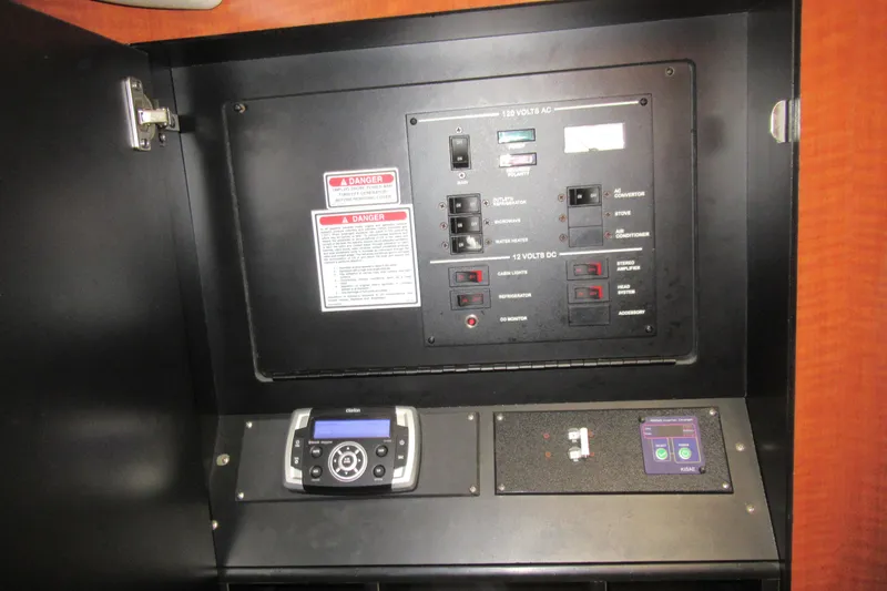 Slide: The Image of Electrical control panel of 2001 Searay 280 Sundancer boat with various switches and controls. - 68