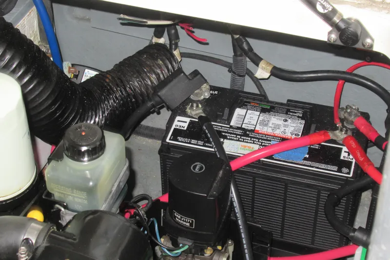 Slide: The Image of Engine compartment of 2001 Searay 280 Sundancer with battery and wiring. - 73