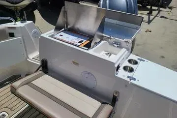 Slide: The Image of 2023 Cutwater C-248 Coupe boat interior with seating and storage area. - 11