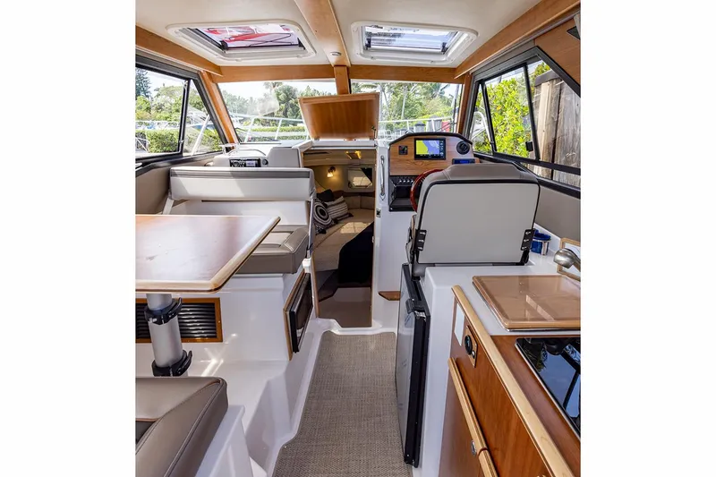 Slide: The Image of Manufacturer Provided Image: Interior of 2023 Cutwater C-248 Coupe boat, featuring modern design and navigation equipment. - 13