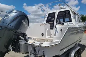 Slide: The Image of 2023 Cutwater C-248 Coupe boat with Yamaha V6 engine, docked under blue sky. - 3
