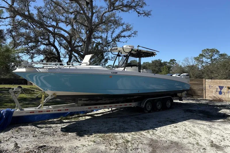 The Image of 2008 Wellcraft 35 Scarab Sport boat parked on trailer outdoors. - 0