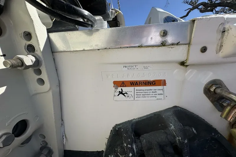 Slide: The Image of 2008 Wellcraft 35 Scarab Sport boat warning label and serial number detail. - 101