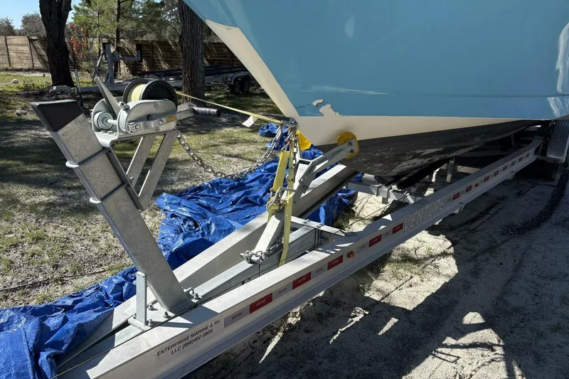 Slide: The Image of 2008 Wellcraft 35 Scarab Sport on trailer, secured with winch and chain. - 103