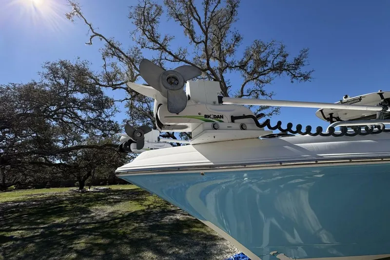 Slide: The Image of 2008 Wellcraft 35 Scarab Sport boat with Rhodan trolling motor under sunny sky. - 109