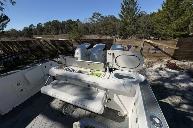 Slide: The Image of 2008 Wellcraft 35 Scarab Sport boat with Suzuki engines, outdoor setting. - 11