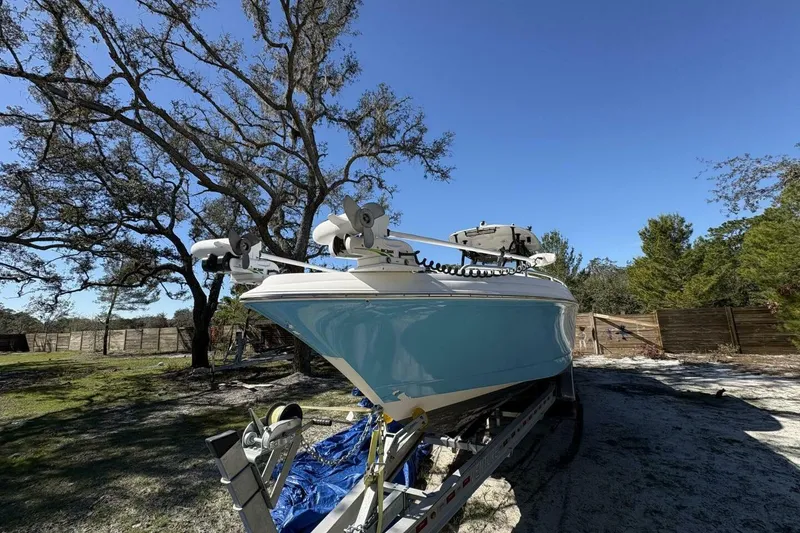 Slide: The Image of 2008 Wellcraft 35 Scarab Sport boat on trailer under clear blue sky. - 110