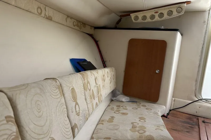 Slide: The Image of Interior of 2008 Wellcraft 35 Scarab Sport boat with patterned seating and storage. - 16