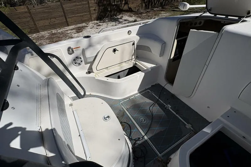 Slide: The Image of 2008 Wellcraft 35 Scarab Sport boat interior with open storage compartments and seating. - 23
