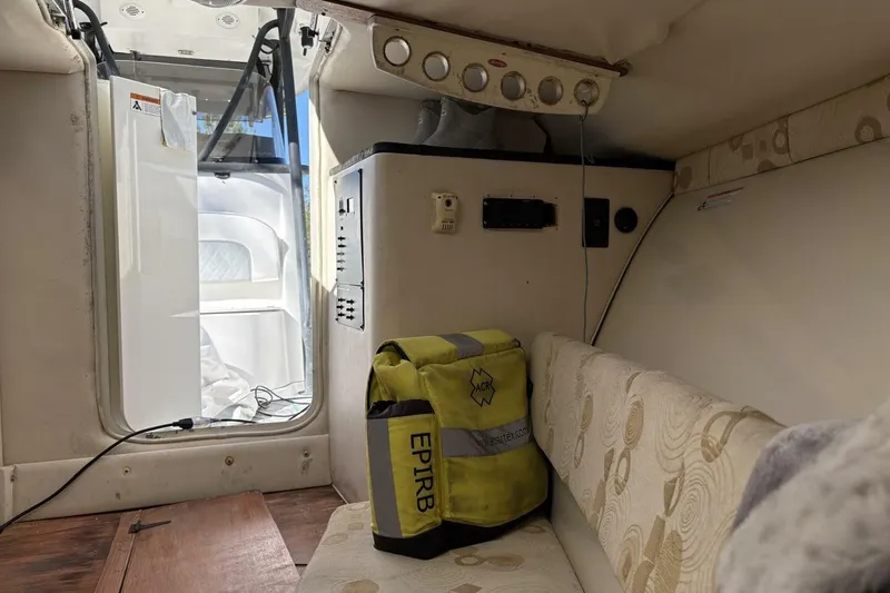 Slide: The Image of Interior of 2008 Wellcraft 35 Scarab Sport boat with EPIRB safety equipment. - 31